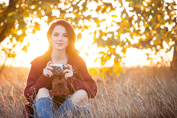 istock Woman with vintage camera 492003532