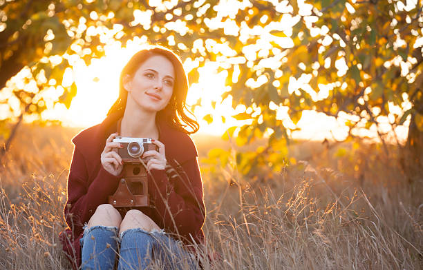 istock Woman with vintage camera 492003568