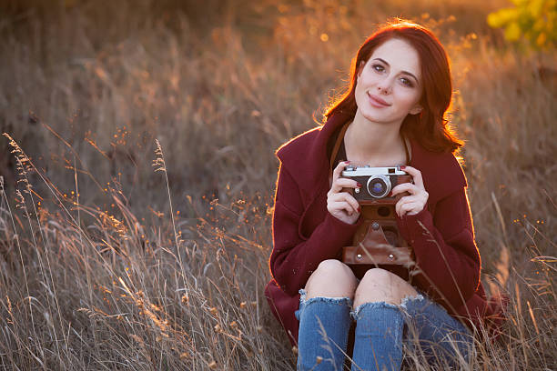 istock Woman with vintage camera 492003620