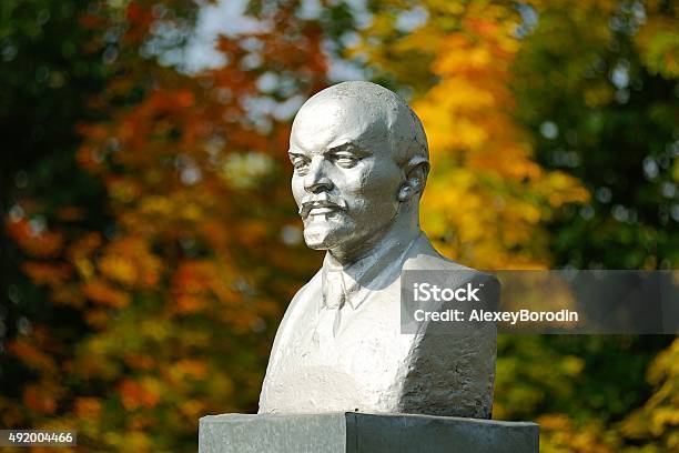 Lenin Bust Monument With Autunm Leaves On The Background Stock Photo - Download Image Now