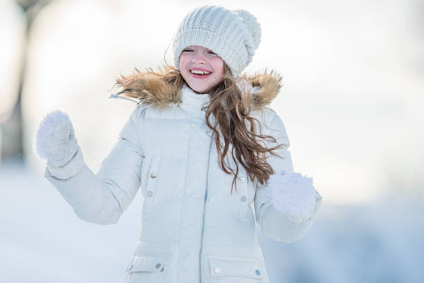 istock Little Girl Playing in the Snow 492004622