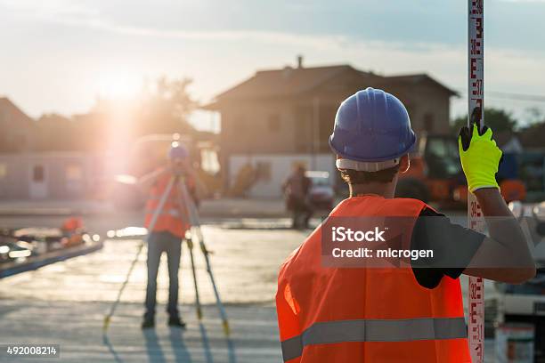 Surveyors At Work Stock Photo - Download Image Now - Surveyor, Land, Construction Site