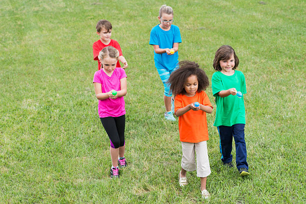 istock Group of children in egg spoon race 492012212