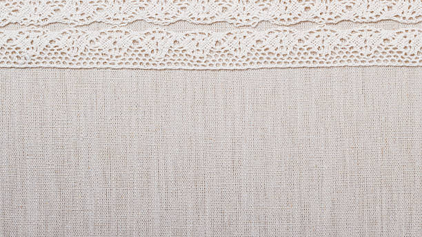 istock Lace ribbon on linen cloth background 492013060