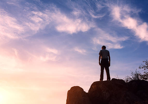 istock Silhouette of a man at the sunset on the mountain 492013114