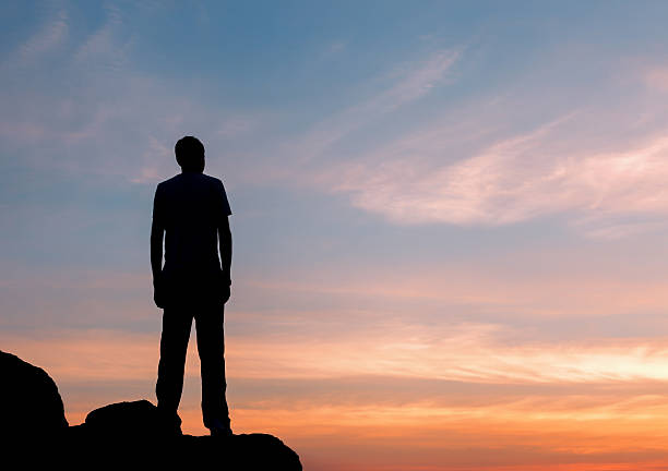 istock Silhouette of a man at the sunset on the mountain 492013192