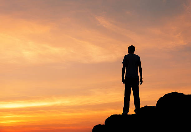 istock Silhouette of a man at the sunset on the mountain 492013220