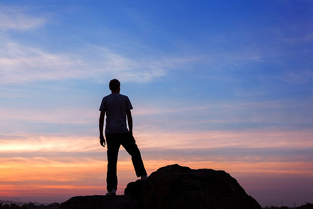 istock Silhouette of a man at the sunset on the mountain 492013236