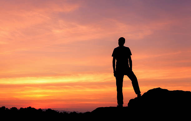 istock Silhouette of a man at the sunset on the mountain 492013252