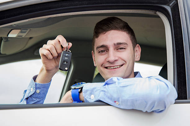 istock Happy young man holding new car keys 492015554