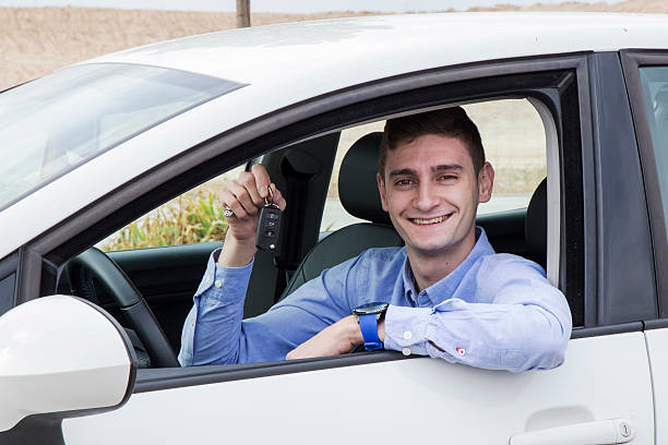istock Happy young man holding new car keys 492015562