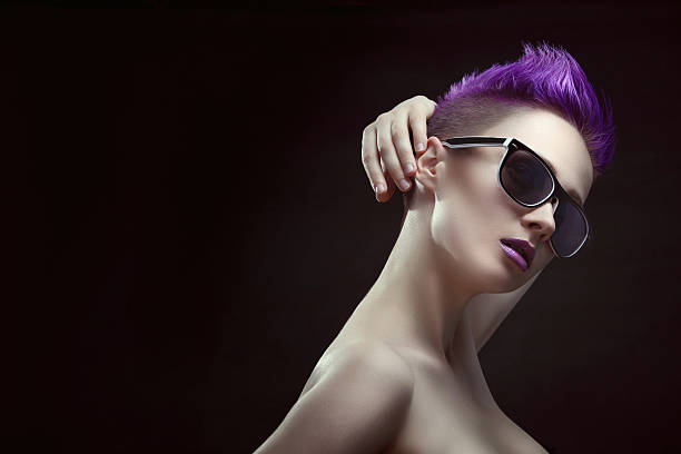 Purple Beauty Beautiful young stylish girl with purple hair and short hair in large stylish sunglasses purple hair stock pictures, royalty-free photos & images
