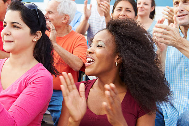 istock Spectators Cheering At Outdoor Sports Event 492022971