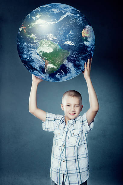 istock Child holding the earth in his hands 492023085
