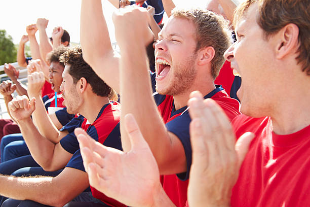 istock Group of young people cheering at sporting event 492023445
