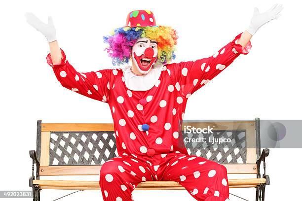 Unhappy Clown Sitting On A Wooden Bench Stock Photo - Download Image Now -  Clown, Sitting, 20-29 Years - iStock