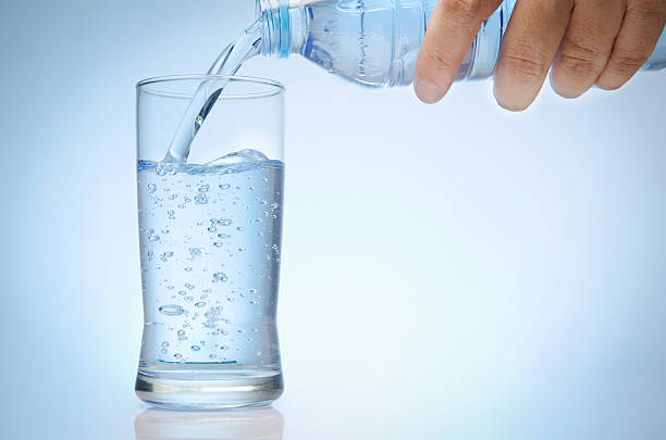 istock glass of water from bottle 492024353