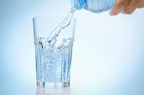 istock glass of water from bottle 492025359