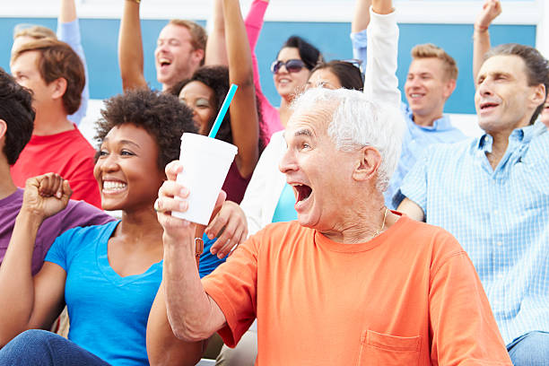 istock Spectators Cheering At Outdoor Sports Event 492026063