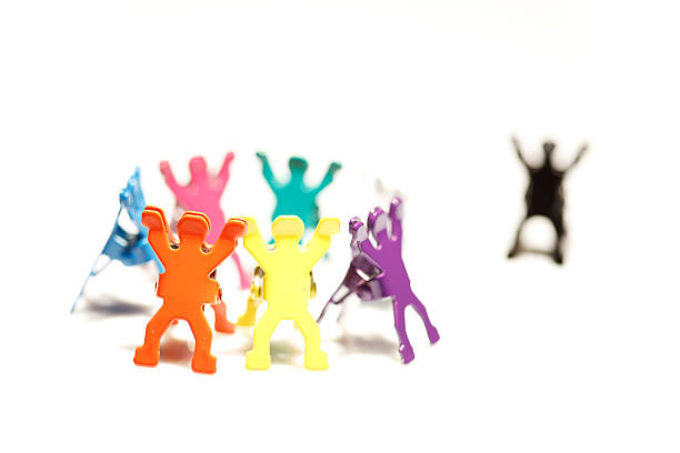 Group of people and one on the side, mobbing concept.