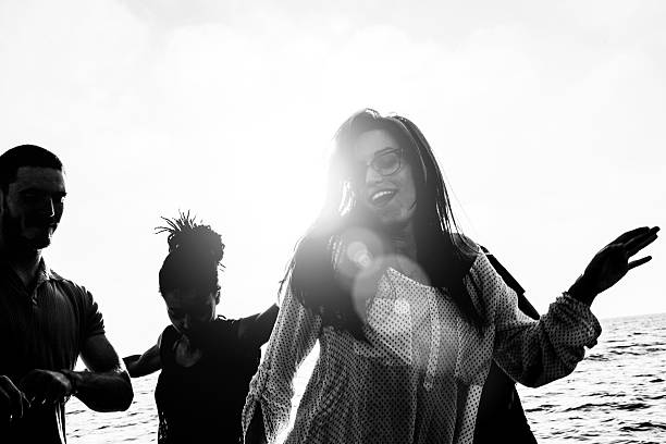 istock Group of multi-ethnic friends dancing on the beach 492028743