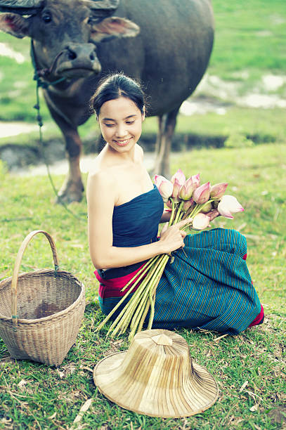 istock thai ancient young women with buffalo on rural 492030648