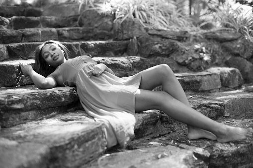 reclining on stone stairs black model