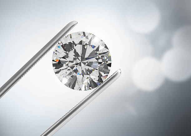 istock Luxury diamond in tweezers 492035440