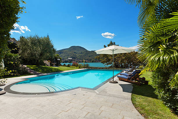 istock beautiful swimming pool overlooking the lake 492037168