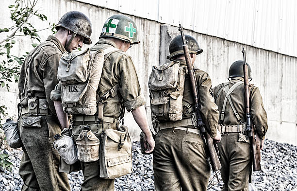 istock WWII US Army Infantry Combat Platoon Walking In Line 492038268