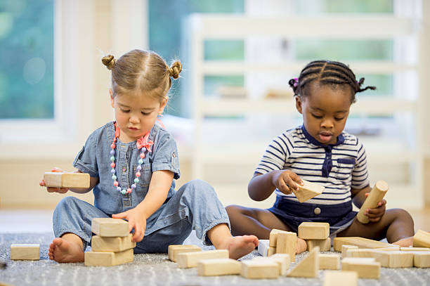 istock Little Girls Playing with Wood Blocks 492038382