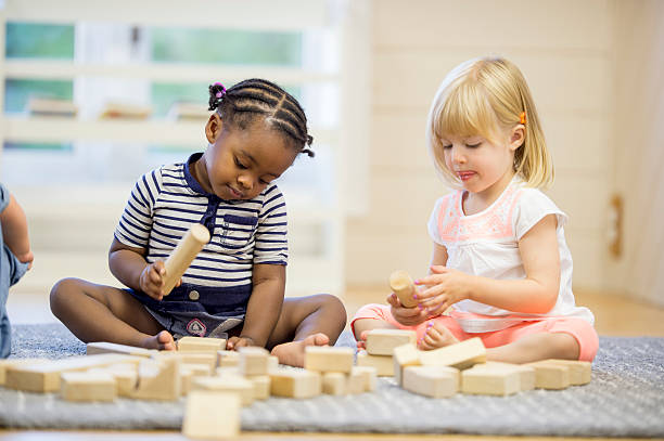 istock Children Playing with Wooden Blocks 492038580
