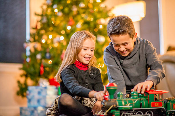 istock Brother and Sister Watching a Toy Train 492039962