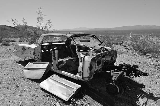 Rhyolite is a ghost town in Nye County, in the U.S. state of Nevada. It is in the Bullfrog Hills, about 120 miles (190 km) northwest of Las Vegas, near the eastern edge of Death Valley. The town began in early 1905 as one of several mining camps that sprang up after a prospecting discovery in the surrounding hills. During an ensuing gold rush, thousands of gold-seekers, developers, miners and service providers flocked to the Bullfrog Mining District. Many settled in Rhyolite, which lay in a sheltered desert basin near the region's biggest producer, the Montgomery Shoshone Mine.