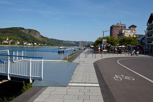 Remagen, Germany - August 31, 2015: The promenade alongside the river Rhine at Remagen (Germany, Rhineland-Palatinate, County Ahrweiler) photographed at sunny daylight with a cloudless blue sky on August 31, 2015.
