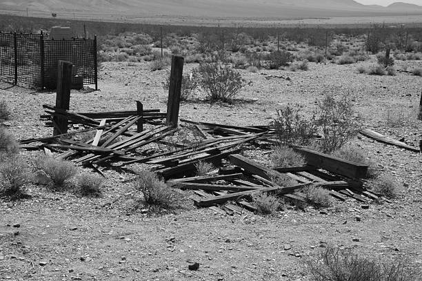 Rhyolite is a ghost town in Nye County, in the U.S. state of Nevada. It is in the Bullfrog Hills, about 120 miles (190 km) northwest of Las Vegas, near the eastern edge of Death Valley. The town began in early 1905 as one of several mining camps that sprang up after a prospecting discovery in the surrounding hills. During an ensuing gold rush, thousands of gold-seekers, developers, miners and service providers flocked to the Bullfrog Mining District. Many settled in Rhyolite, which lay in a sheltered desert basin near the region's biggest producer, the Montgomery Shoshone Mine.