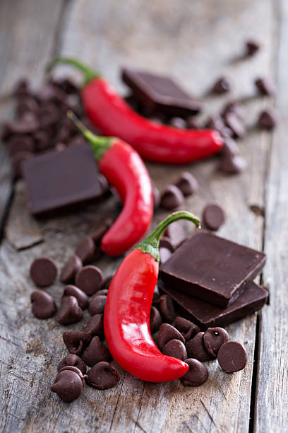 istock Dark chocolate pieces and chips with hot chilli pepper 492045462