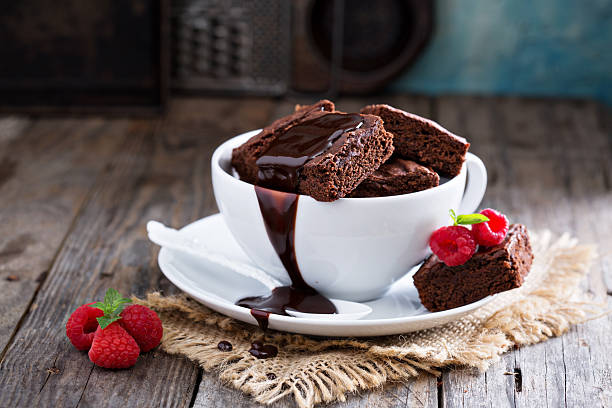 istock Brownies in stacked coffee cups with chocolate sauce 492045716