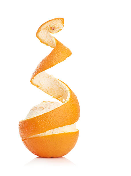 istock orange with peeled spiral skin 492055571
