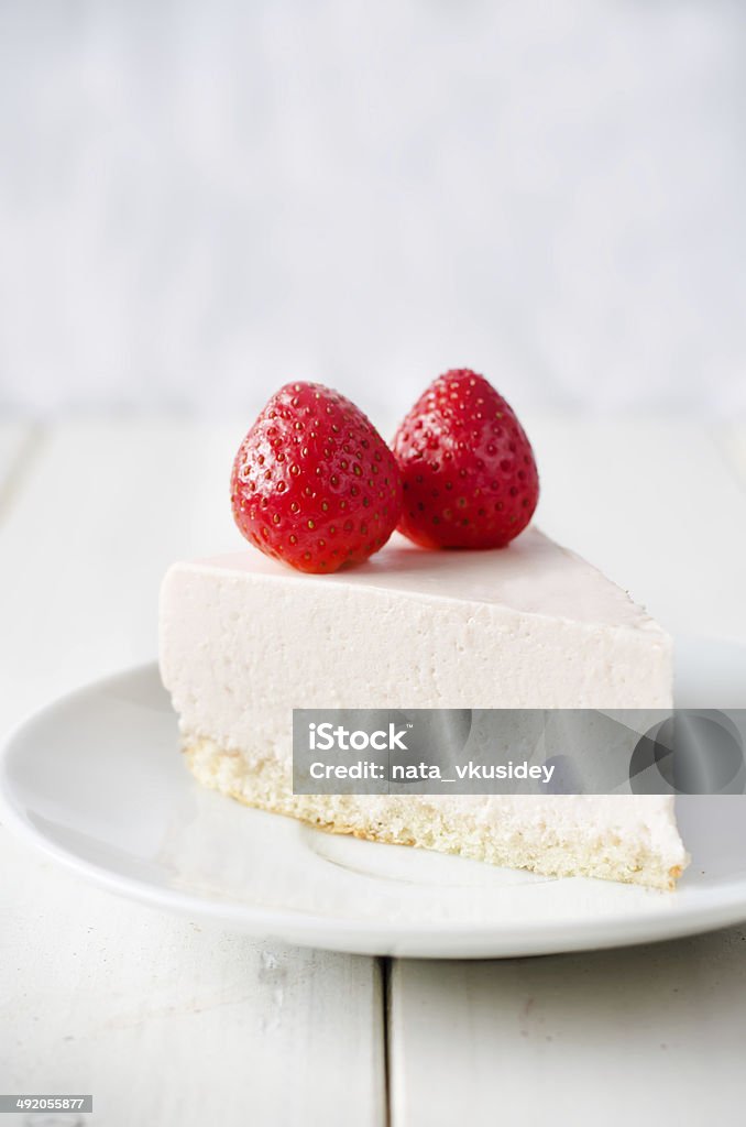 cheesecake with strawberry cheesecake with strawberry in white wood background. toning. selective focus on the front of the cheesecake Cake Stock Photo
