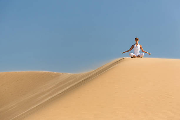 istock Yoga meditation on the beach 492056469