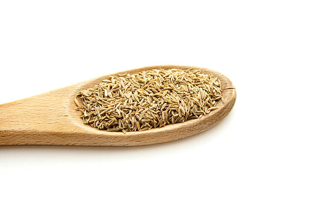 Fresh Cumin on wooden Cooking Spoon Fresh Cumin on wooden Cooking Spoon aromatisch stock pictures, royalty-free photos & images