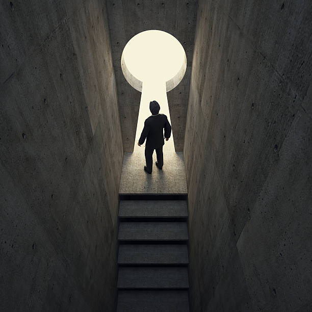istock Silhouette of businessman standing in keyhole. 492057287