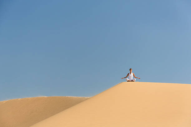 istock Yoga meditation on the beach 492057561