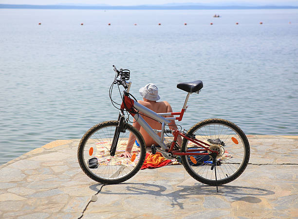 istock cyclist and the bicycle on the coast 492057919