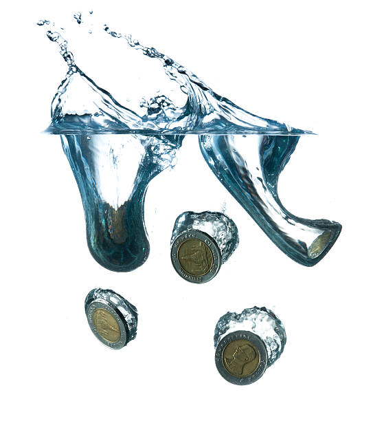 istock money in water with bubbles on white background 492057949
