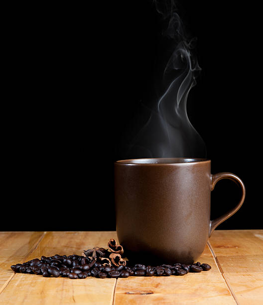 istock cup of black coffee over grunge wood 492059263