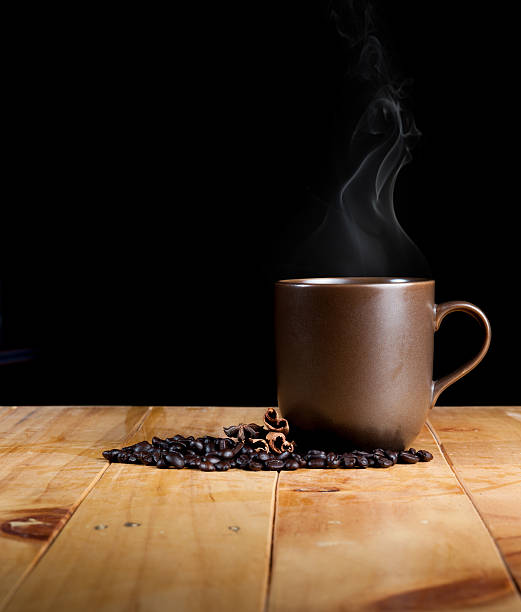 istock cup of black coffee over grunge wood 492059321
