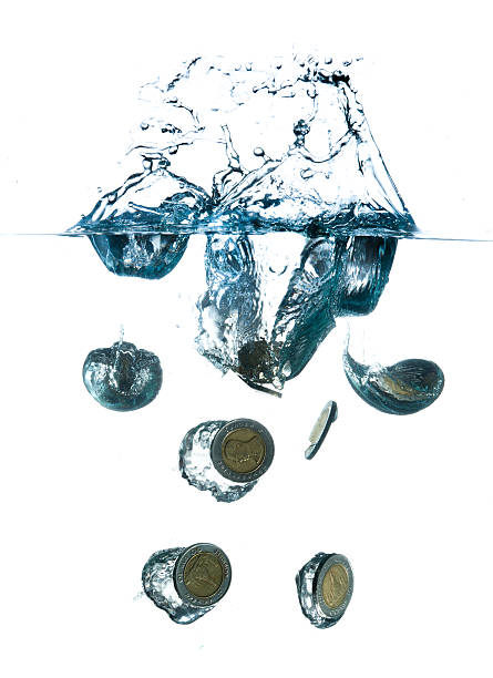 istock money in water with bubbles on white background 492059471