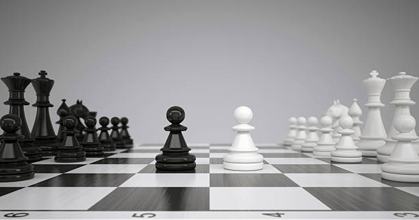 istock Two pawns in the middle of a chessboard 492060571